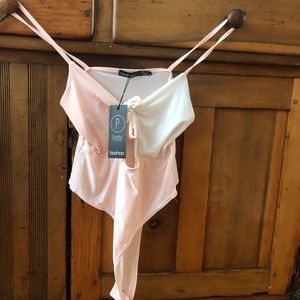 White and pink body suit